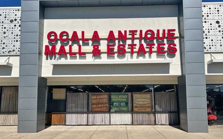 front exterior of strip mall store with sign at ocala antique mall and estates