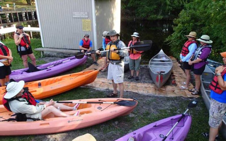 group of kayakers and canoers with instructor on bank at lake griffin state park fruitland ocala