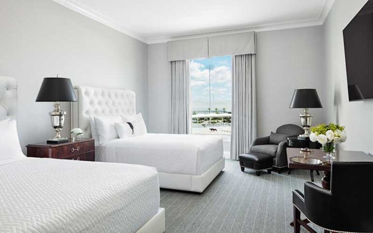 guest room with two king beds and view at the equestrian hotel ocala