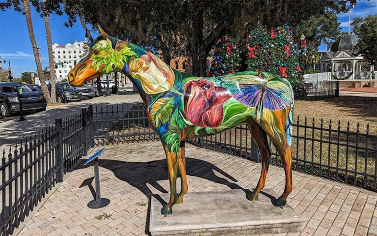 horse statue with flowers painted in plaza area at ocala downtown square