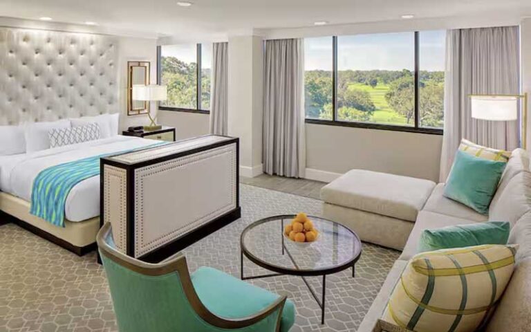 king suite with sofa and view at hilton ocala