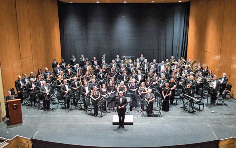 large orchestra on stage viewed from balcony at saenger theatre pensacola