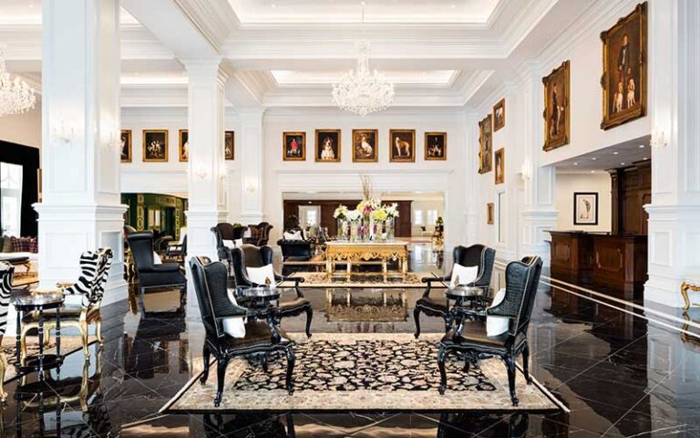 luxurious lobby with columns and portraits at the equestrian hotel ocala