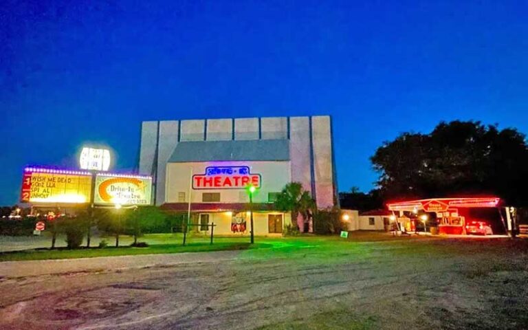 night view of theater entrance with sign at ocala drive in