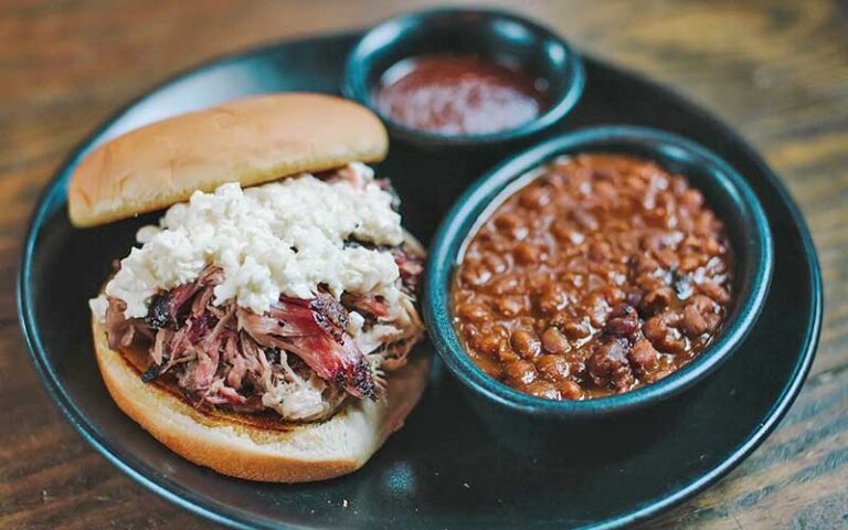 pulled pork sandwich with slaw and beans at brick city southern kitchen ocala