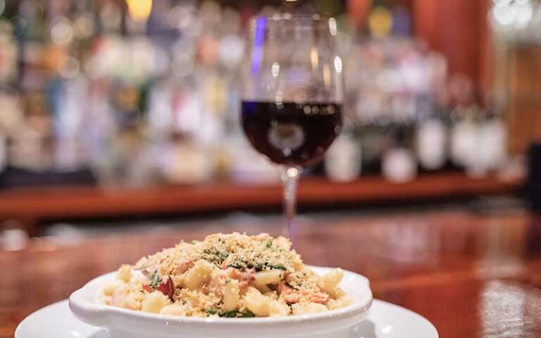 red wine and pasta dish on bar at braised onion ocala