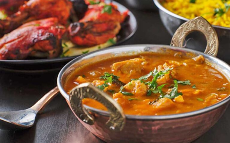 saag bowl with tandoori chicken bowl at amrit palace ocala