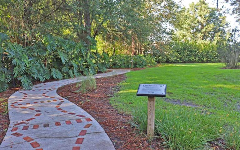 sidewalk labyrinth with sign and brick pattern at sholom park ocala