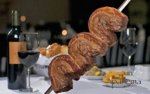 skewered steaks with wine and table setting at ipanema brazilian steak house ocala