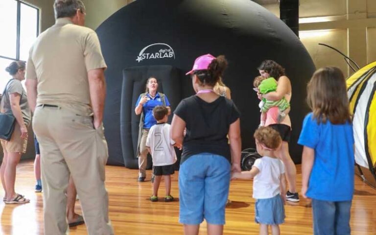 tour group with guide and starlab bubble at discovery center ocala