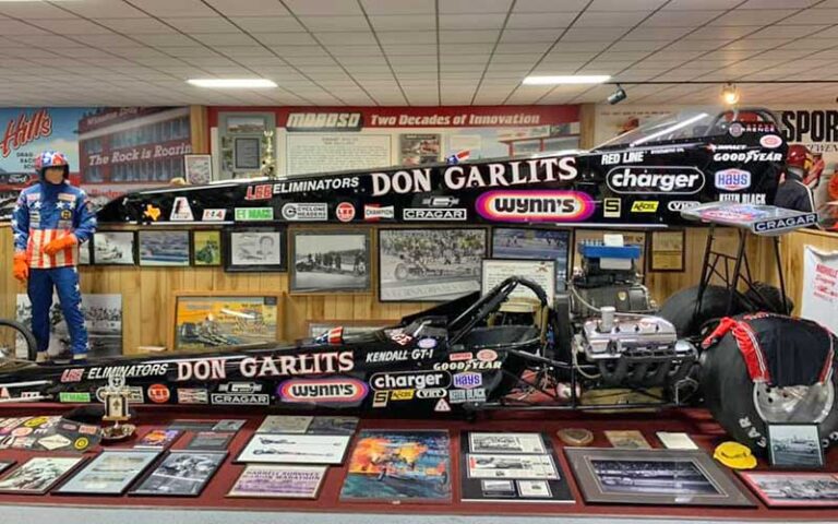 two black dragsters on display with signage at don garlits museum of drag racing ocala