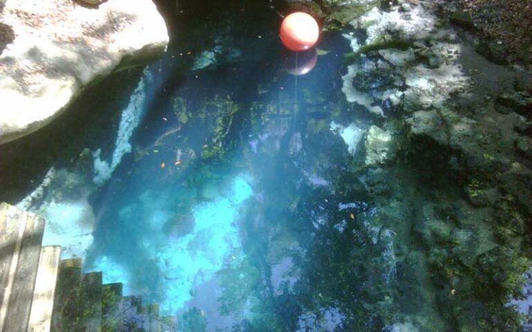 view down into clear water passage with float at paradise springs ocala