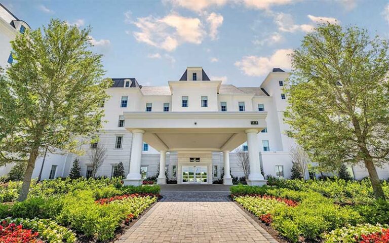 view of front entrance and landscaping at the riding academy hotel ocala