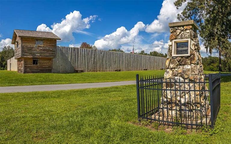 wooden fort with stone monument marker at fort king national historic landmark ocala