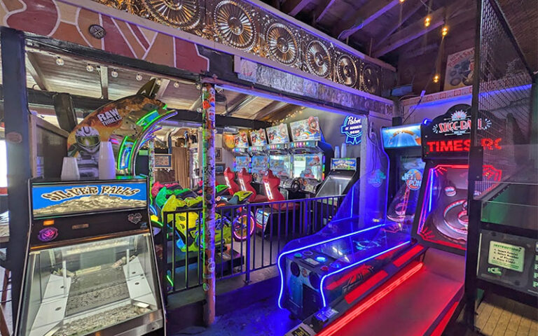 bar interior with skee-ball and racing games at sarbez st augustine