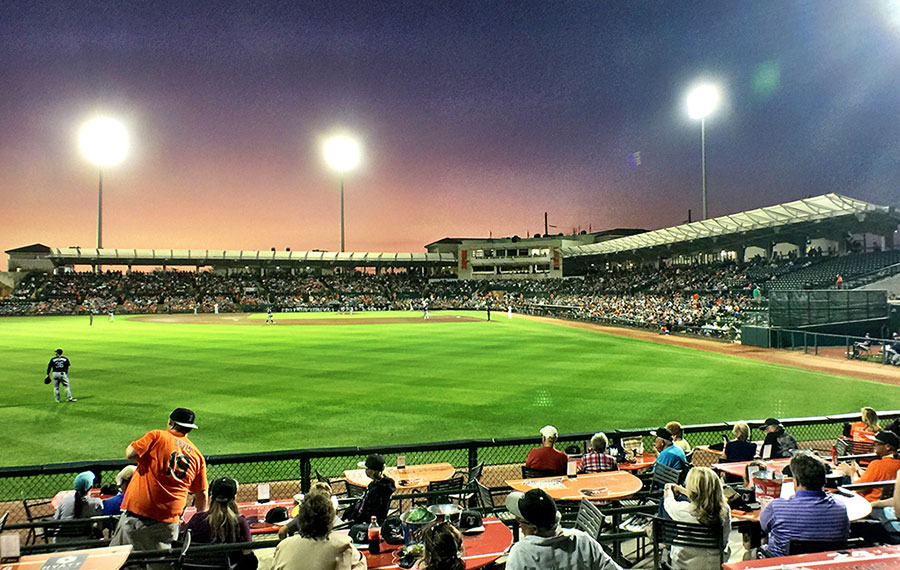 baseball field with stands and spotlights at night ed smith stadium sarasota