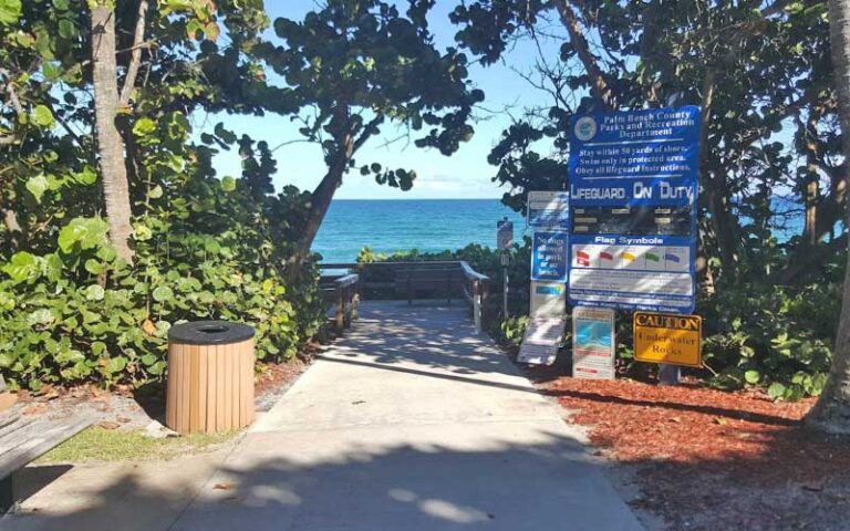 beach entrance with showers and lifeguard signs at gulfstream park delray beach