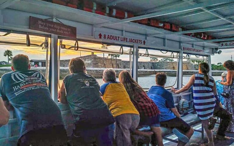 boat group looking out windows at fort at florida water tours st augustine