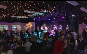 concert venue with band on stage and seated crowd at arts garage delray beach