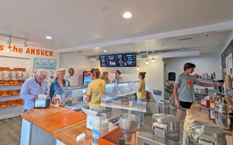 diners at counter in shop with orange accents at orange octopus siesta key sarasota