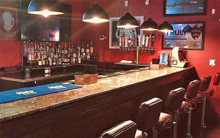 full bar with pendant lights at silverball retro arcade delray beach