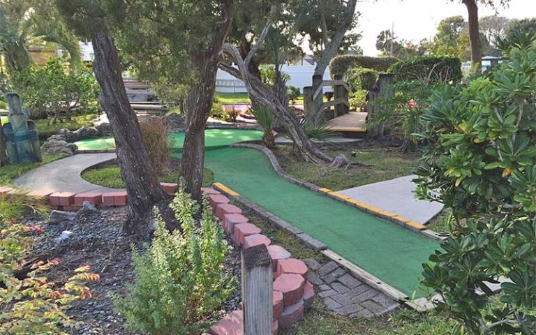 green putting course with trees at anastasia miniature golf st augustine