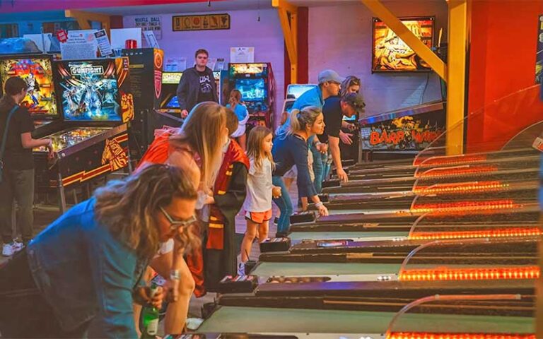 kids playing skeeball in crowded arcade at silverball retro arcade delray beach