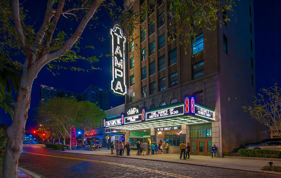 night street view of lighted theater building with marquee sign tampa theatre