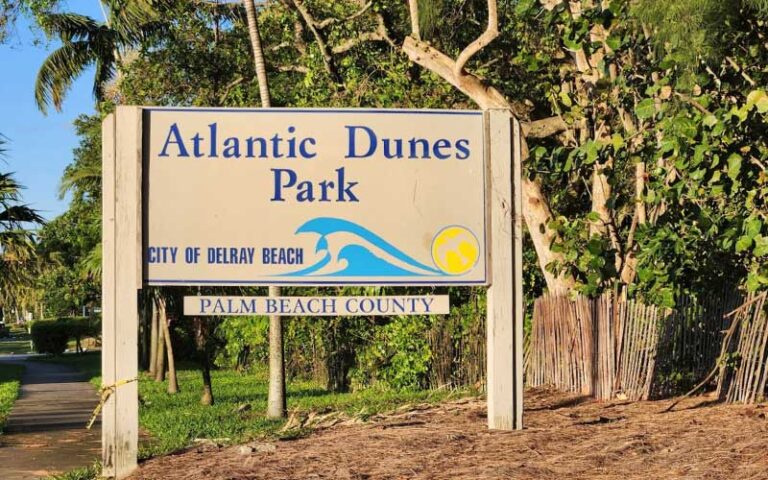 park sign along road and walkway at atlantic dunes park delray beach