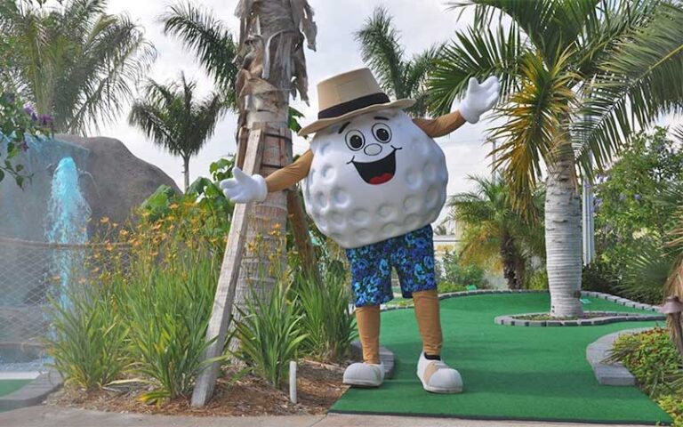 putting green with fountain and golf ball character at puttin around delray beach