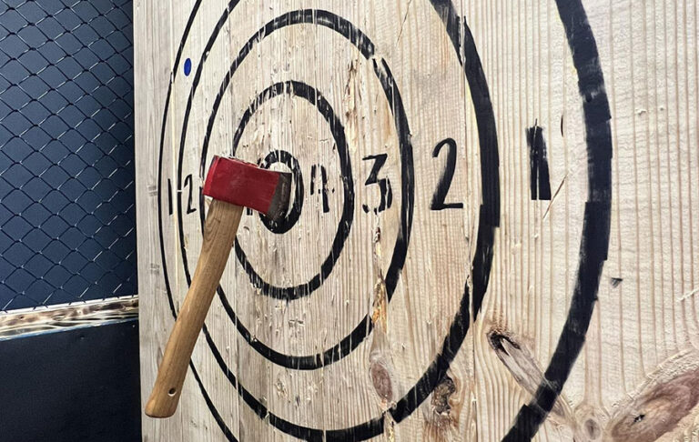 wood target board with axe stuck in at xscape our rooms st augustine