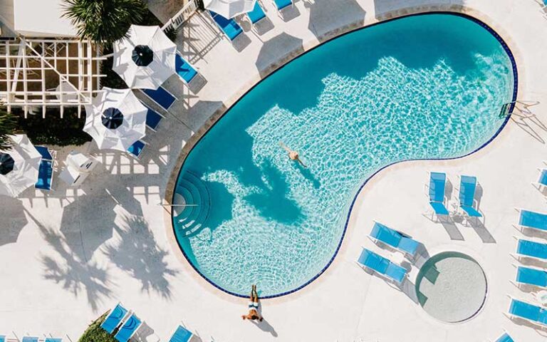 aerial view of kidney shaped pool and deck at delray sands resort highland beach