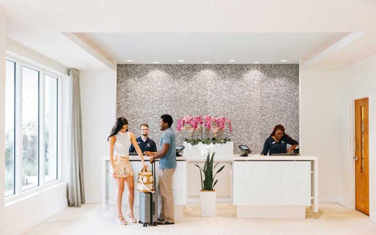 check in desk with guests at delray sands resort highland beach