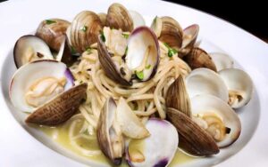 clam linguine in white bowl at le sorelle restaurant boca raton