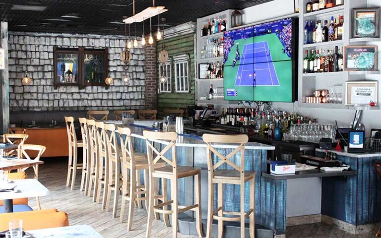 coastal bar interior with screens at mussel beach delray beach