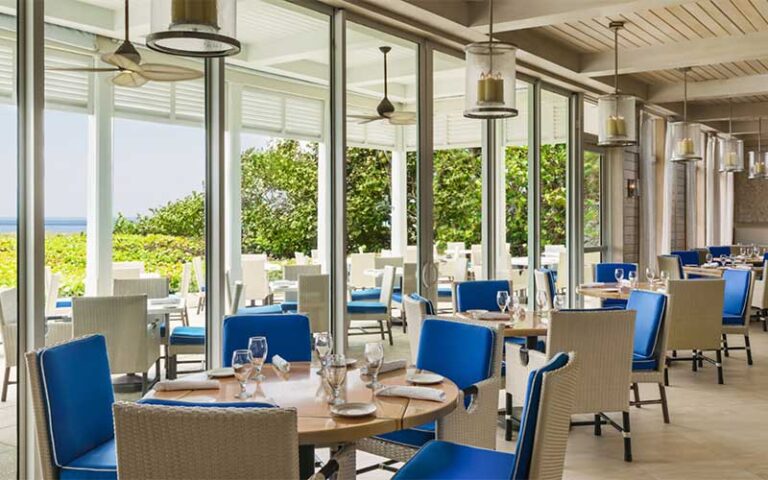 dining area interior with veranda and ocean at the seagate beach club delray beach