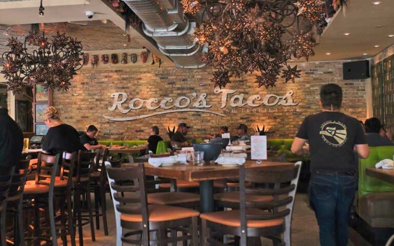 dining room interior with seating and mural at roccos tacos tequila bar delray beach