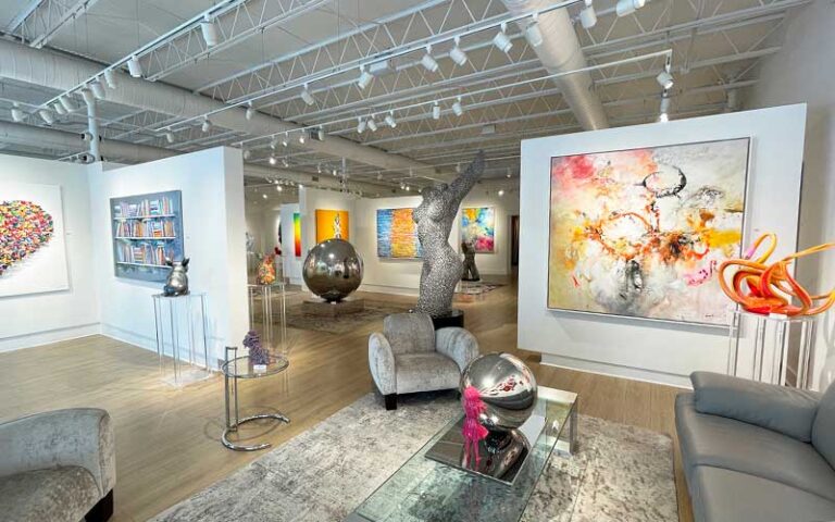 exhibit space with sculptures and seating at blue gallery delray beach