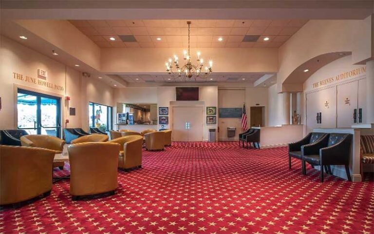 front lobby of theater with chandelier at delray beach playhouse