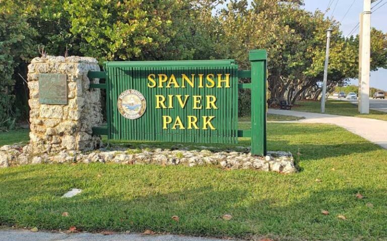 green wood and masonry park sign along road at spanish river park boca raton