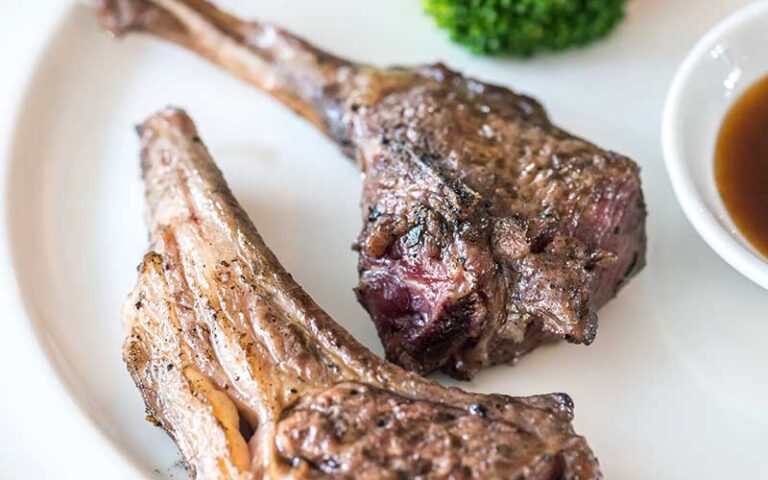 lamb chops with sauce and broccoli at le sorelle restaurant boca raton