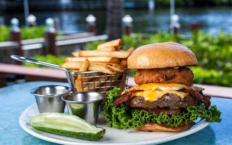 large burger entree with steak and seafood at deck 84 delray beach