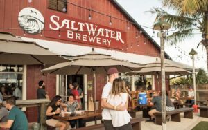 outdoor beer garden with patio tables at saltwater brewery delray beach