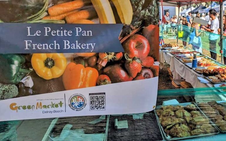 outdoor market tent with bakery items at delray beach greenmarket