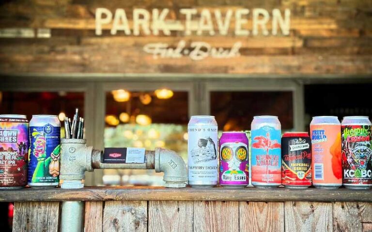 patio deck with sign and row of craft beers at park tavern delray beach