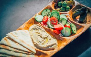 sampler tray with pita hummus and olives at dada delray beach