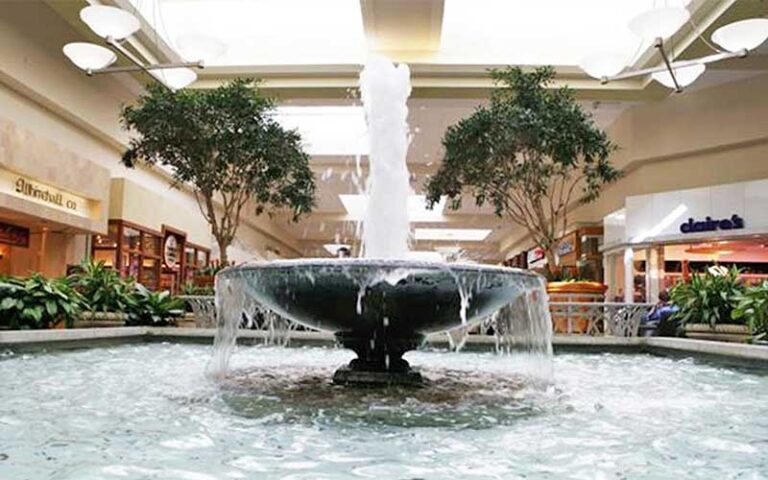 splashing fountain indoor with atrium and shops at boynton beach mall