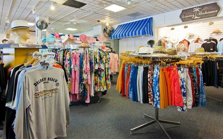 store interior racks with swim trunks and shirts at south ocean beach shop delray beach