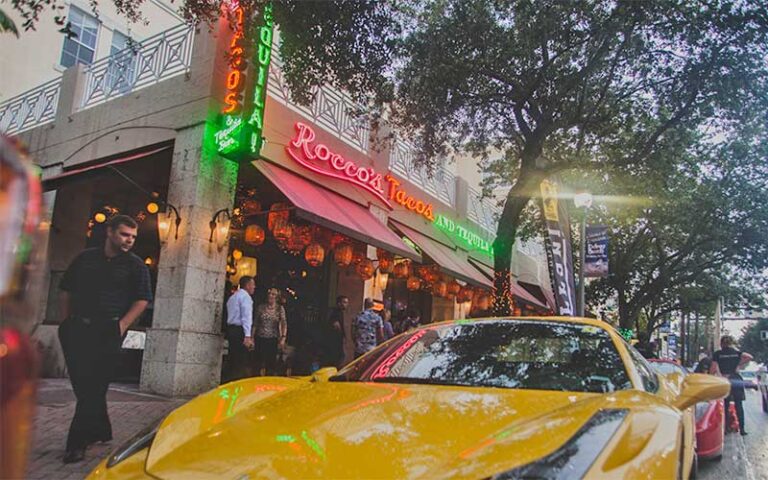 street corner exterior of restaurant with cars at roccos tacos tequila bar delray beach