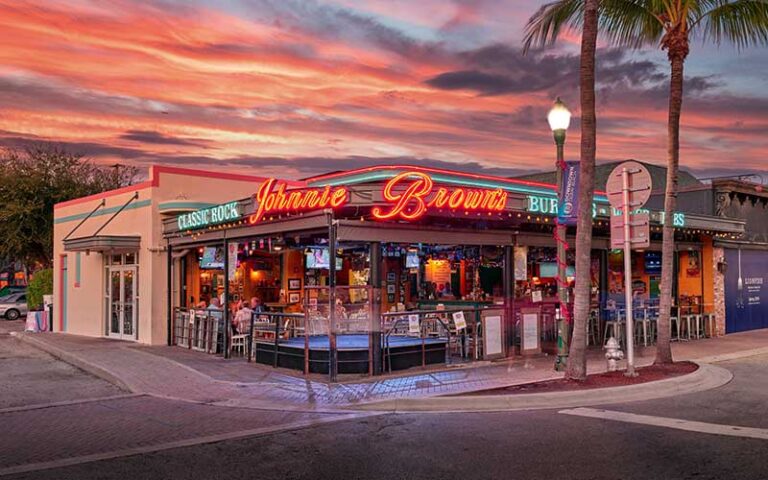 street corner exterior with sunset sky at johnnie browns delray beach